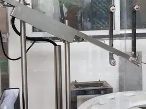 Unità di posizionamento dei tappi